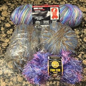 Four skeins of colorful yarn.